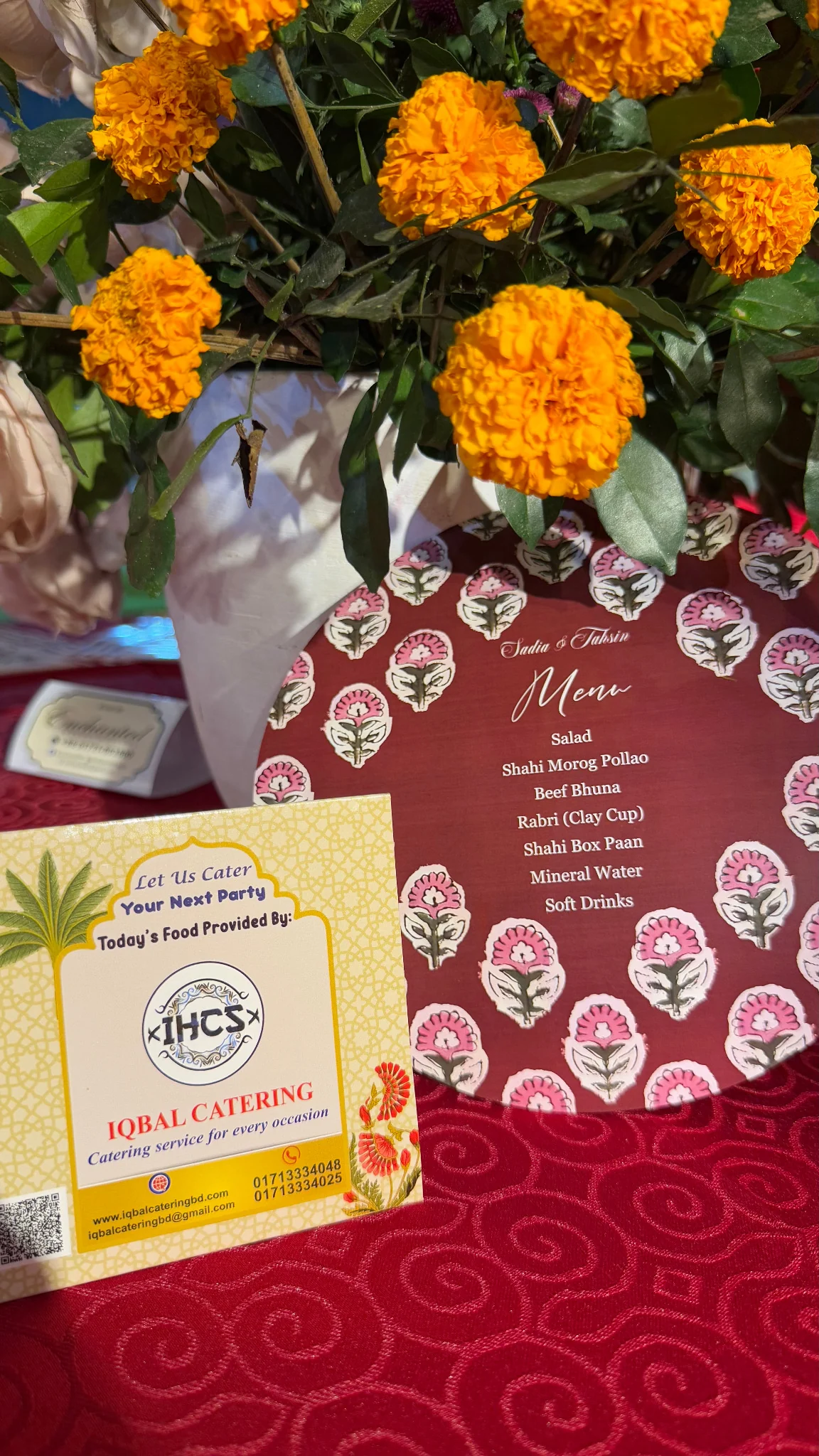 Marigold floral arrangement with menu display