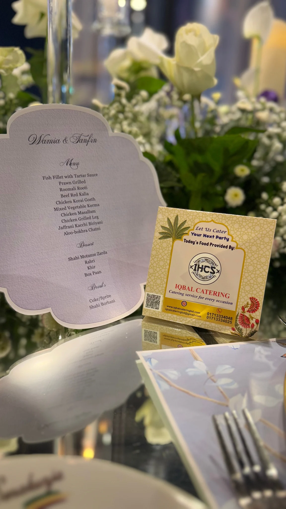 Menu card and branded table display at an event